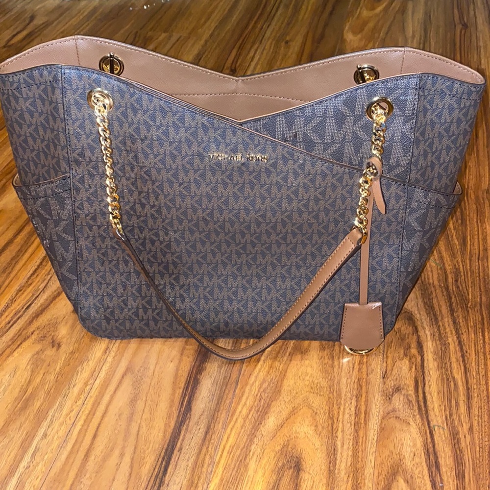 Brown and tan Michael kors bag
